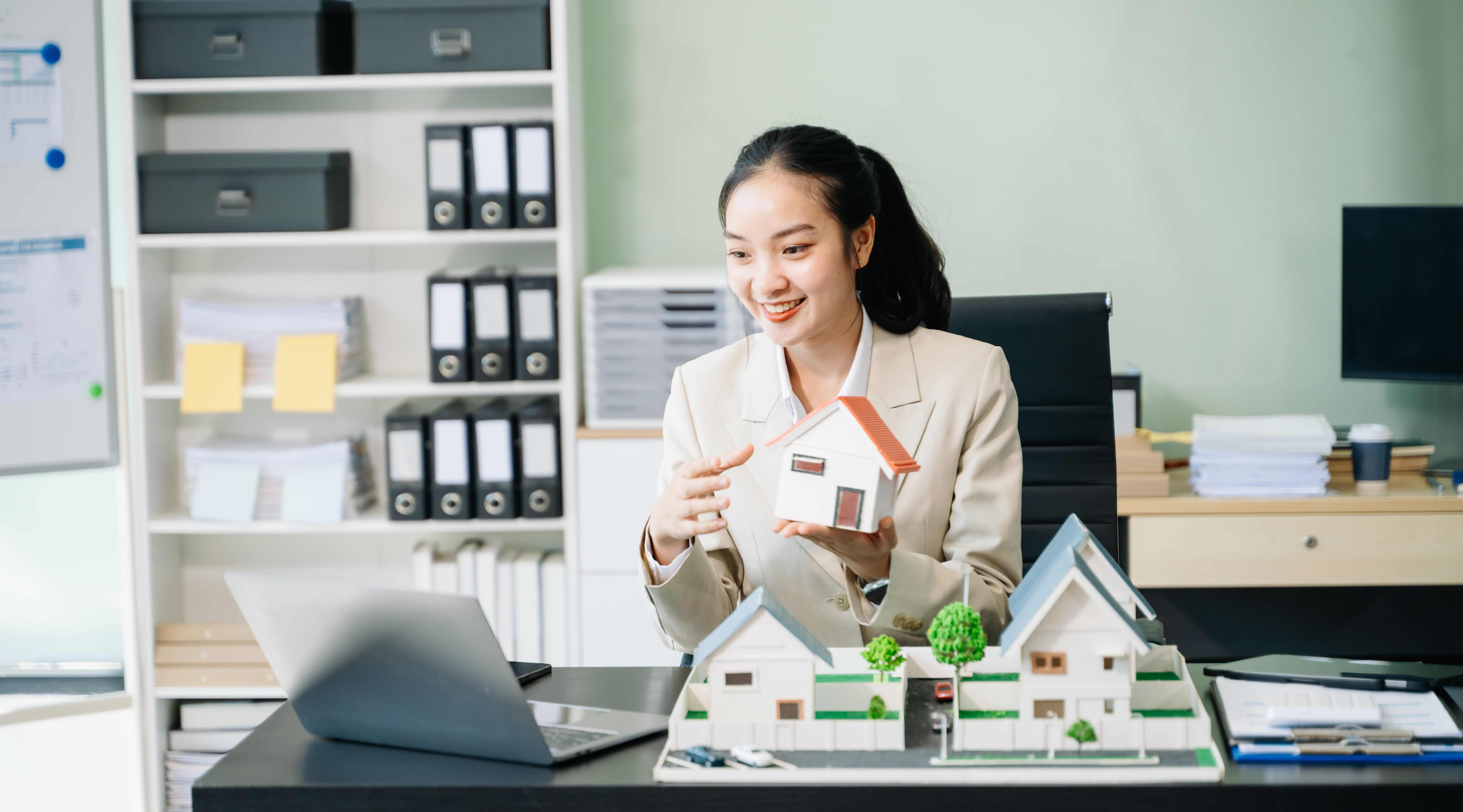 young real estate agent worker working with laptop young real estate agent worker working with laptop