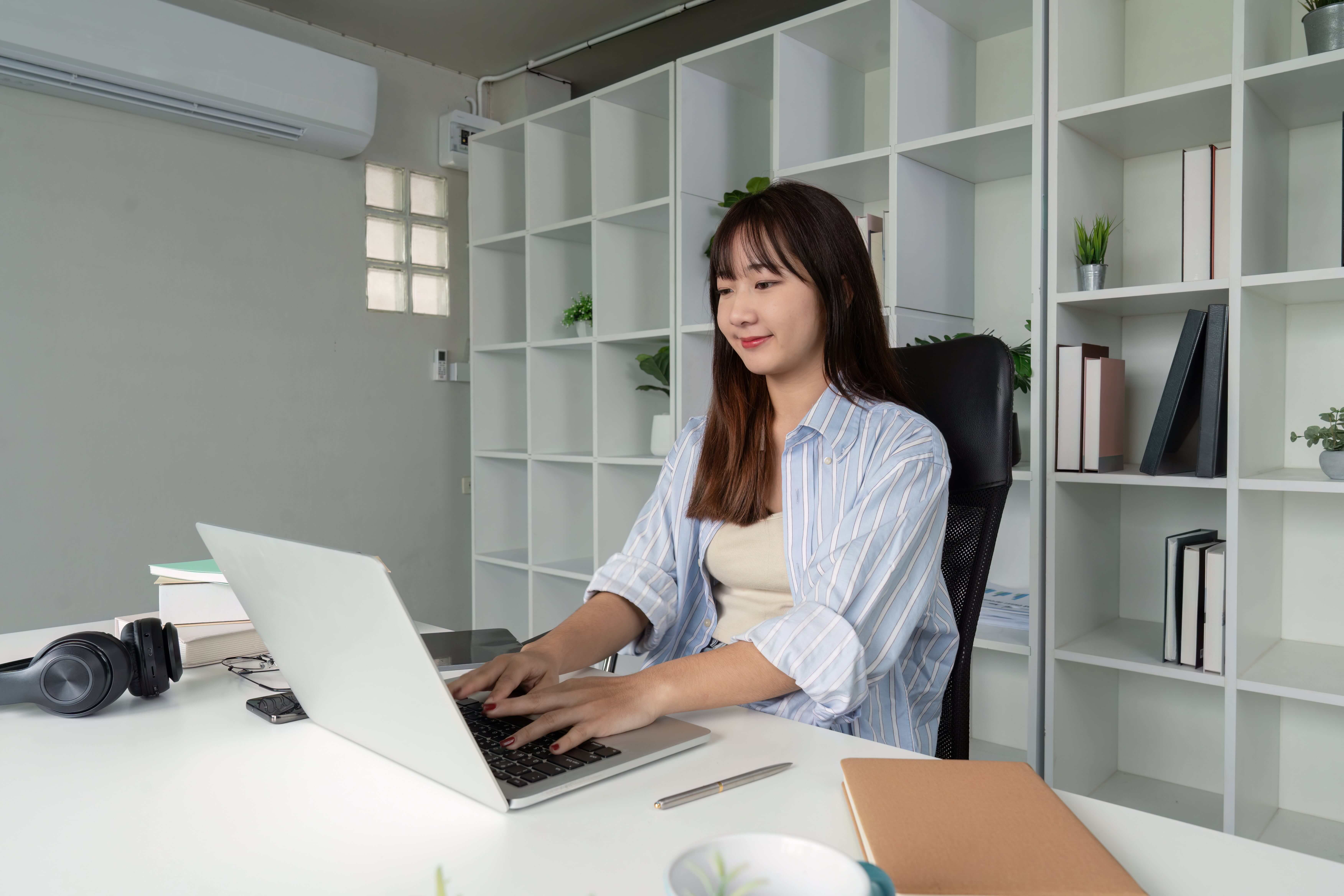 dedicated young woman attending remote working