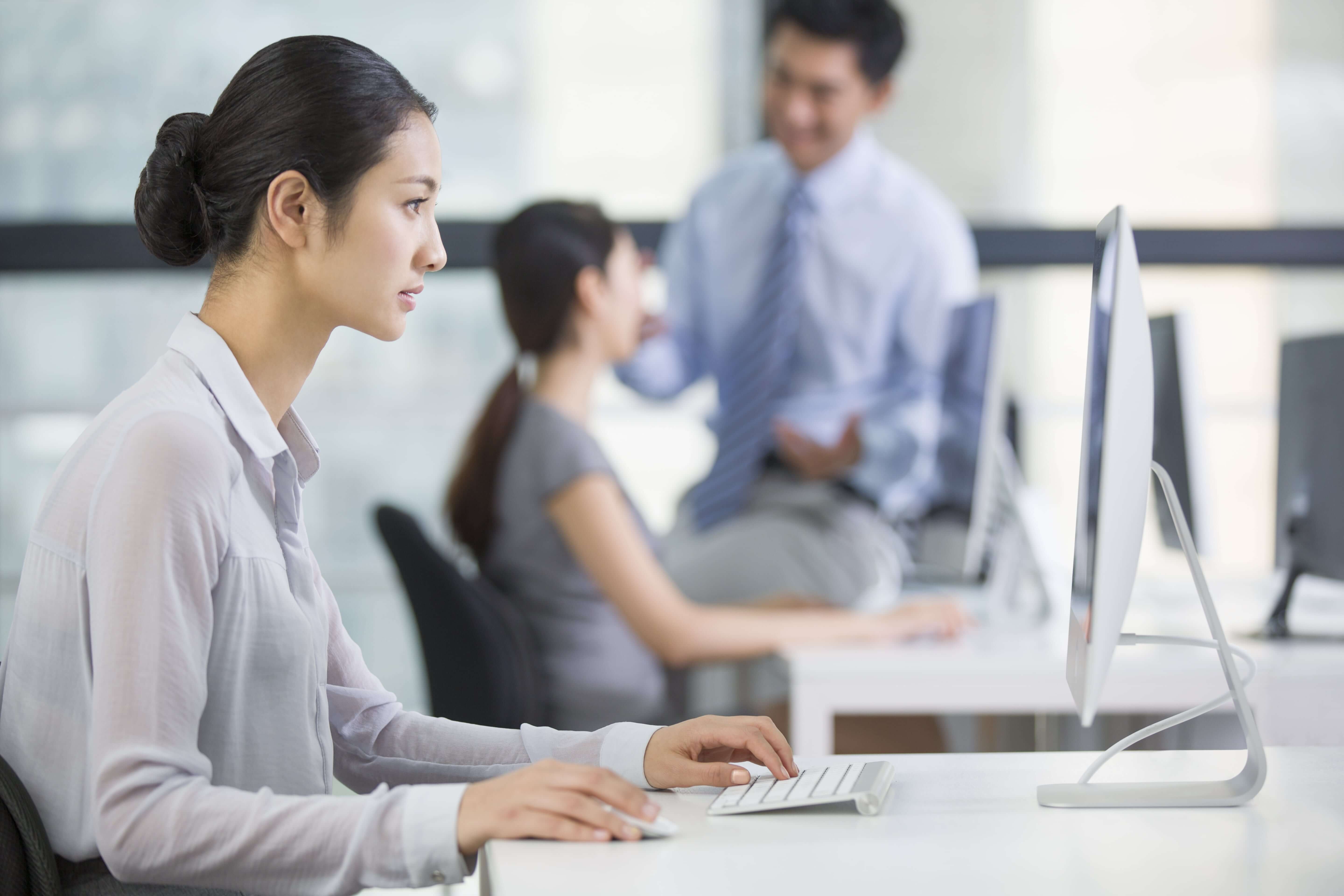 young businesswoman using computer in office
