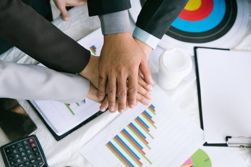business-team-stacking-hands-unity