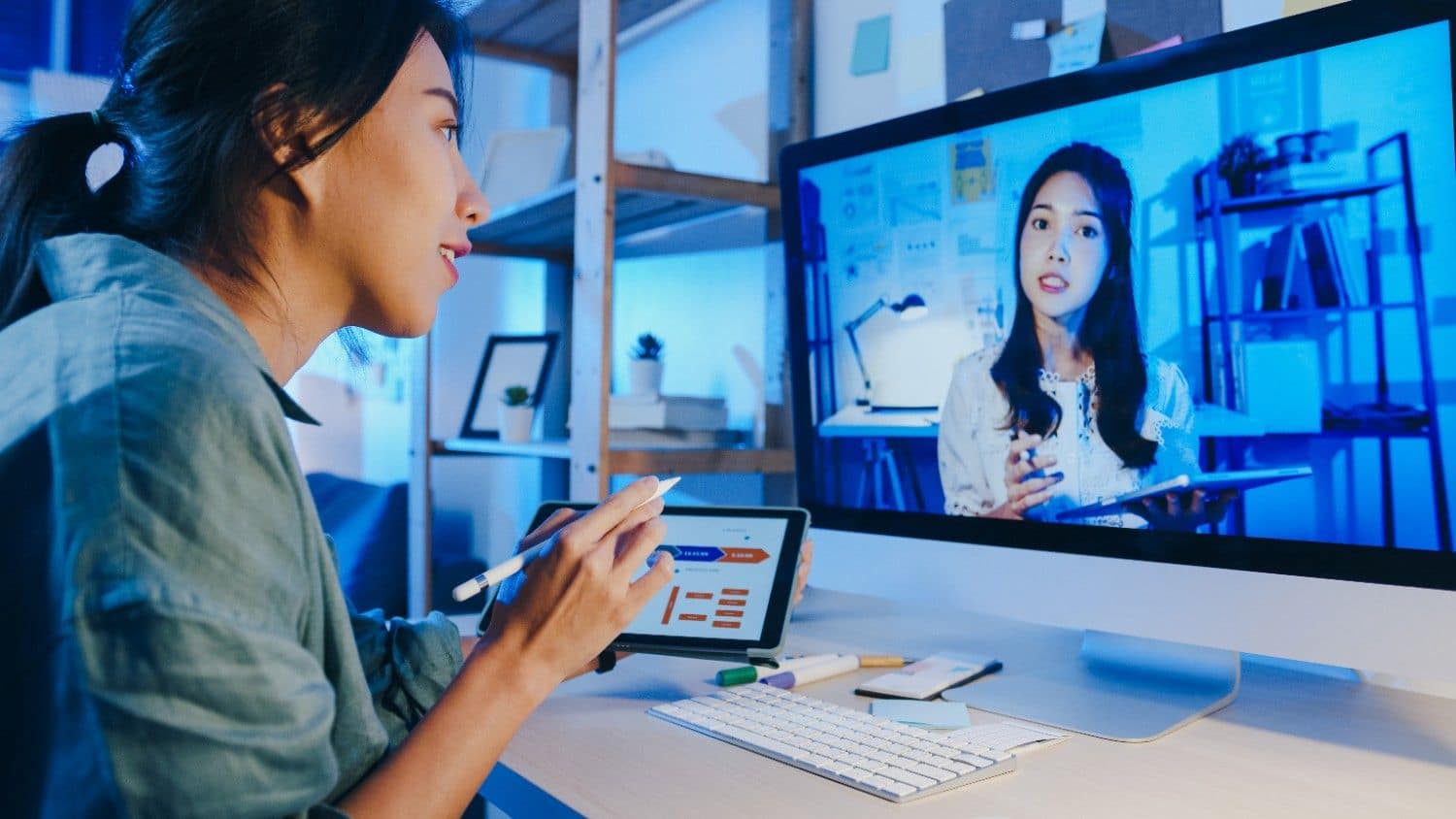 Executive communication virtual assistant on a video meeting at their desk