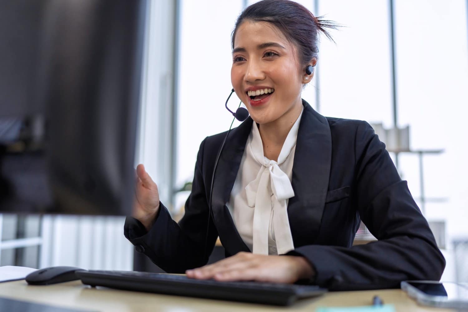 professional-customer-support-agent-working-at-computer-desk.jpg