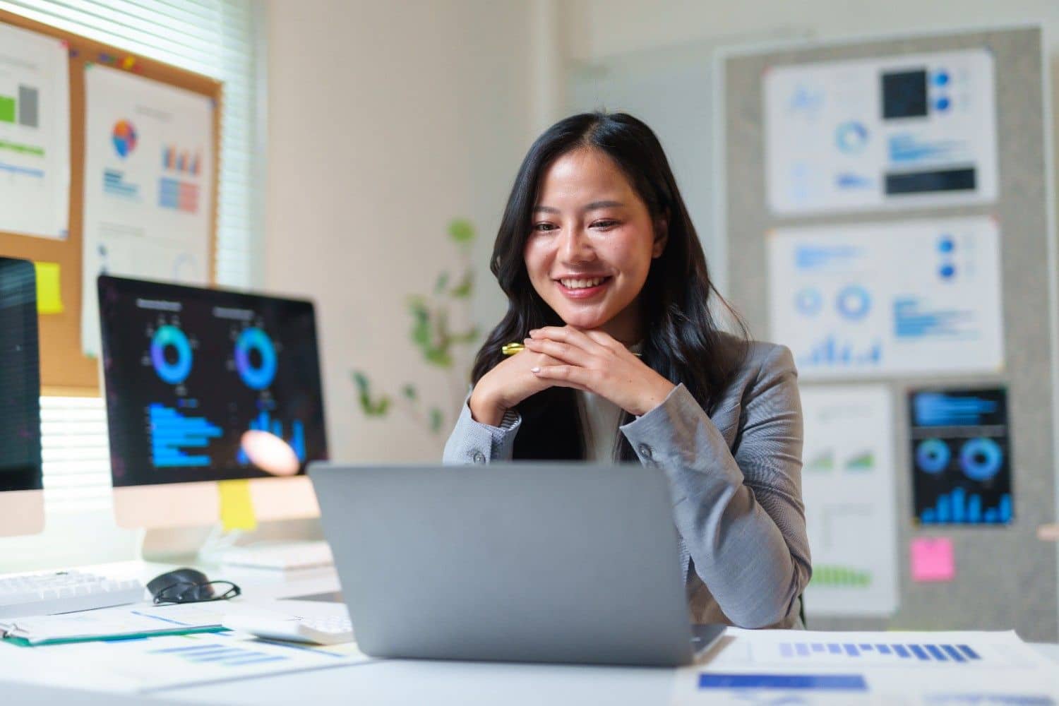businesswoman-reviewing-data-analytics-on-laptop-office.jpg