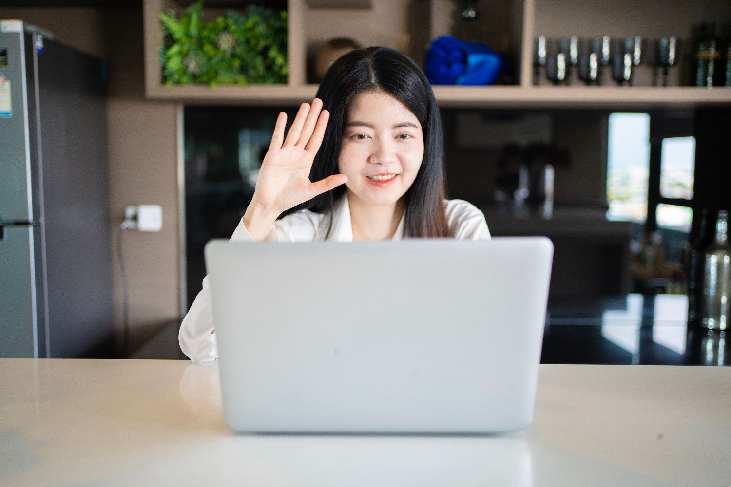 Professional customer support agent working at a laptop