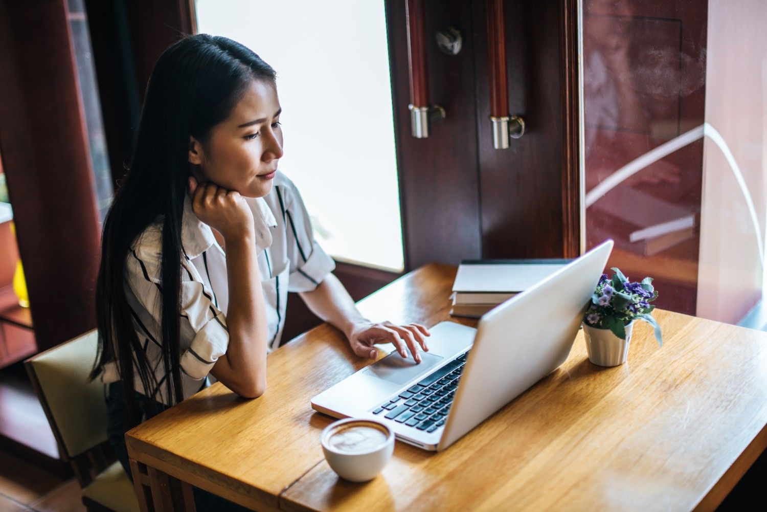 Digital nomad freelance writer laptop coffee shop