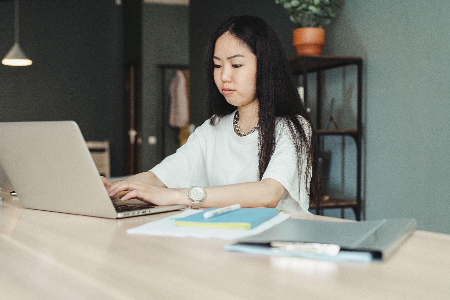Remote administrative assistant working at desk